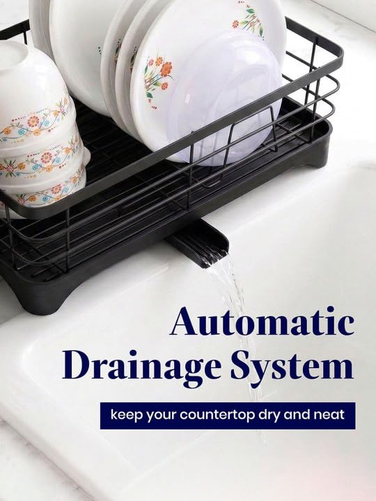 Black countertop dish rack with a gravity drainage outlet directing water from the drainboard into the sink